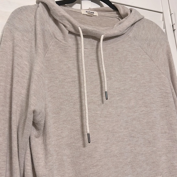 Tan hoodie by garage - Picture 3 of 4